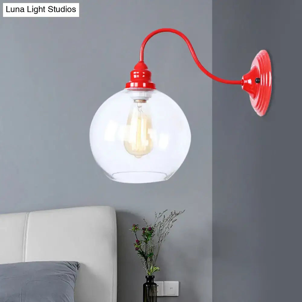 Industrial red metal and glass globe wall light fixture with exposed filament bulb for bedroom lighting