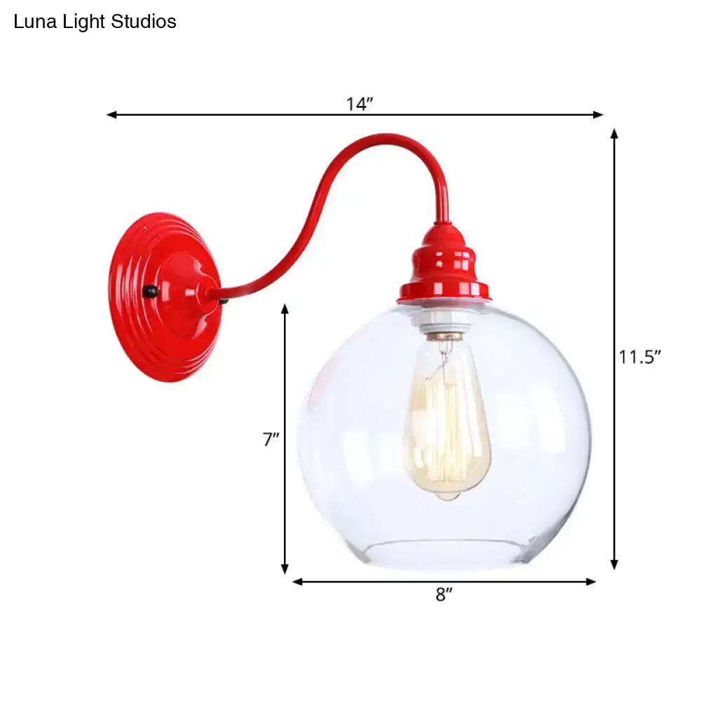 Industrial red metal wall light fixture with clear glass globe and exposed filament bulb for bedroom sconce use