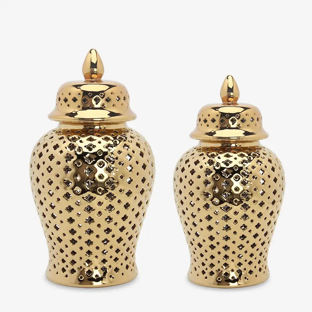 Gold ceramic carved temple jars with intricate diamond cutouts and matching lids for elegant home decor