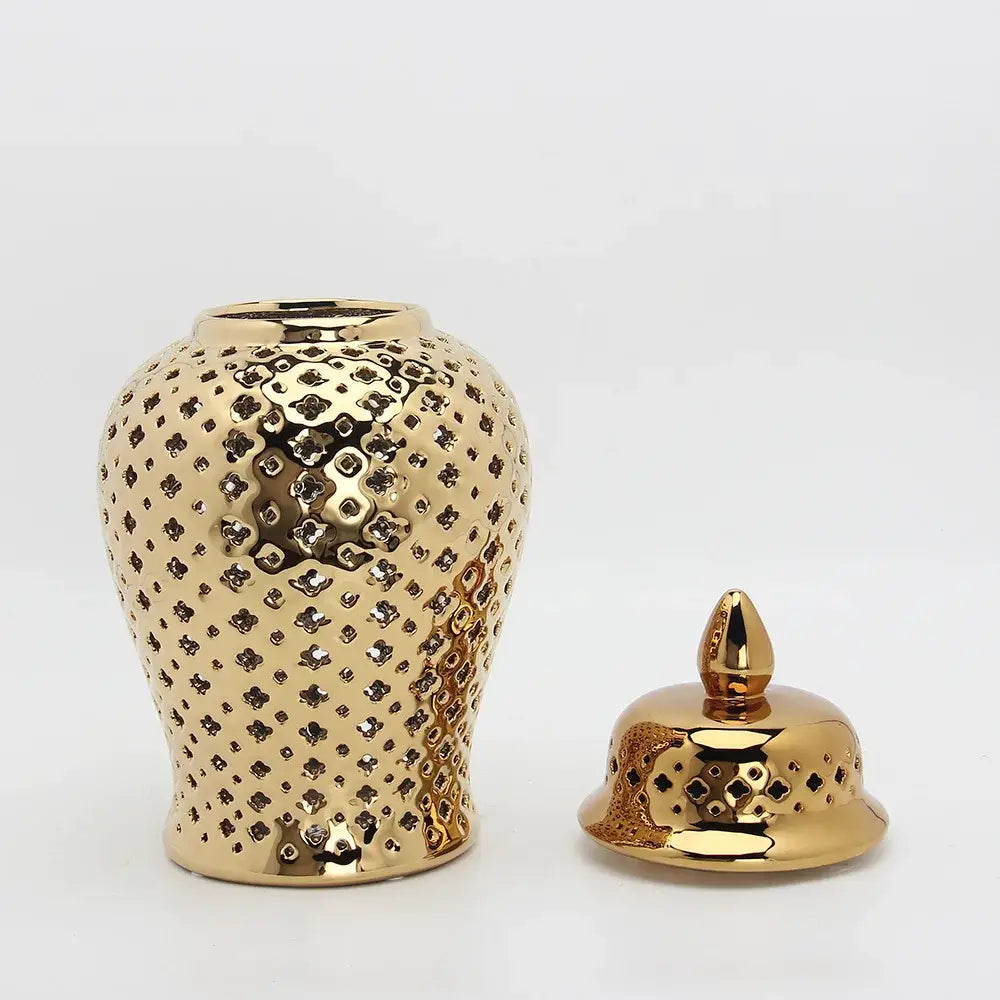 Gold ceramic carved temple jar with intricate geometric cut-out patterns and matching lid for home decor