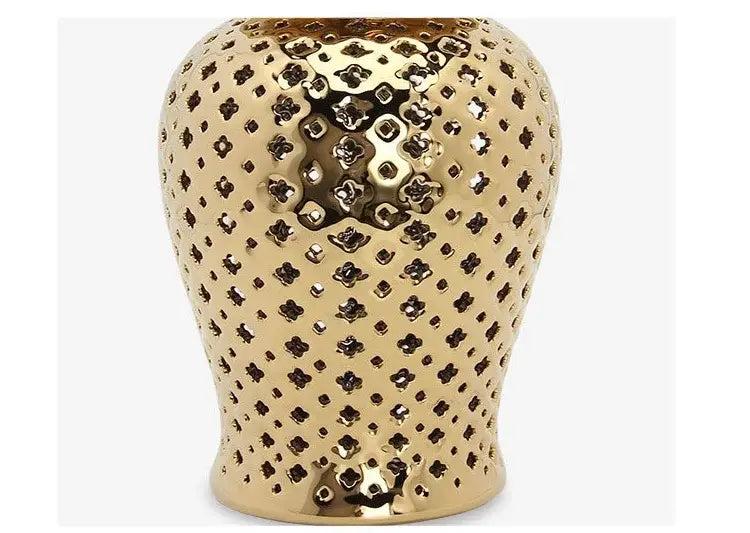 Gold ceramic carved temple jar with intricate perforated floral patterns for elegant home decor