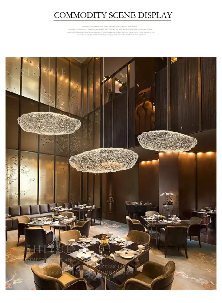 Three gold cloud pendant lights with sparkling crystal mesh design hang elegantly for home and restaurant decor
