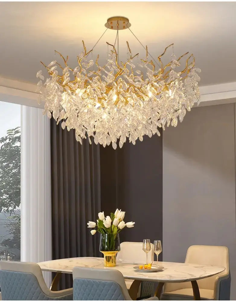 Golden branch chandelier from decorbites featuring clear crystal leaves for elegant home lighting with gold crystal led design