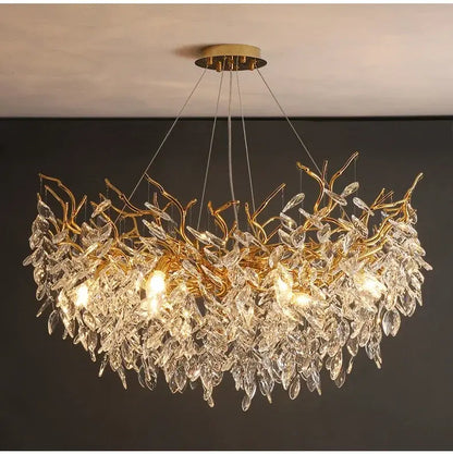 Gold crystal led chandelier with golden leaf design and clear crystal accents for elegant home lighting by decorbites