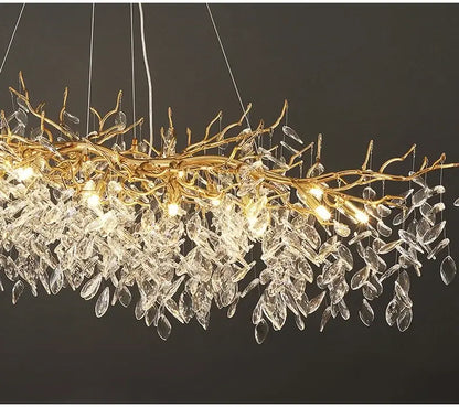 Golden branch chandelier with clear crystal leaves and hanging lights from DecorBites gold crystal led collection