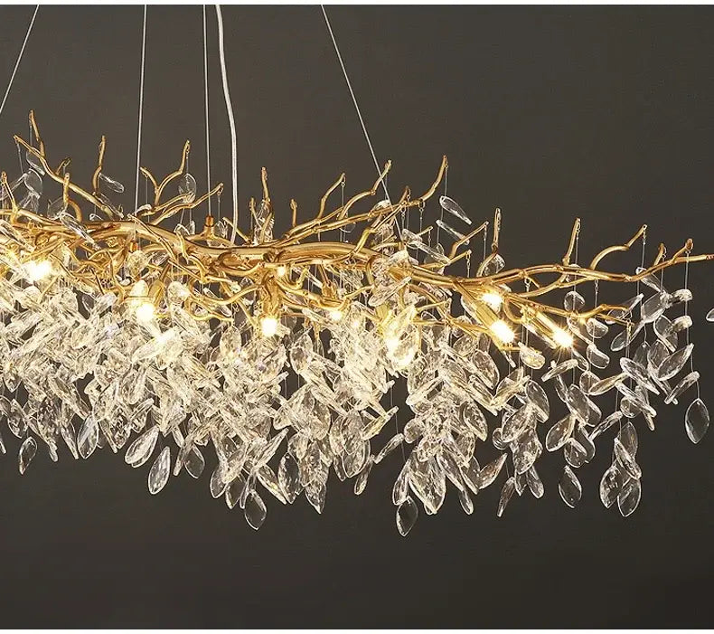 Golden branch chandelier with clear crystal leaves and hanging lights from DecorBites gold crystal led collection