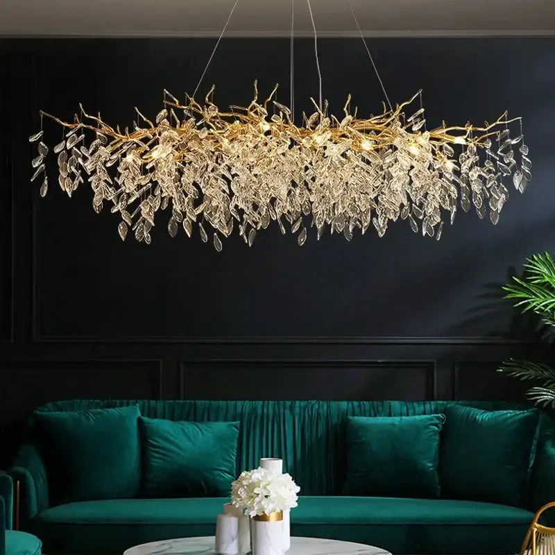 Gold crystal led chandelier by decorbites featuring branch-shaped design with dangling crystal leaves for home lighting