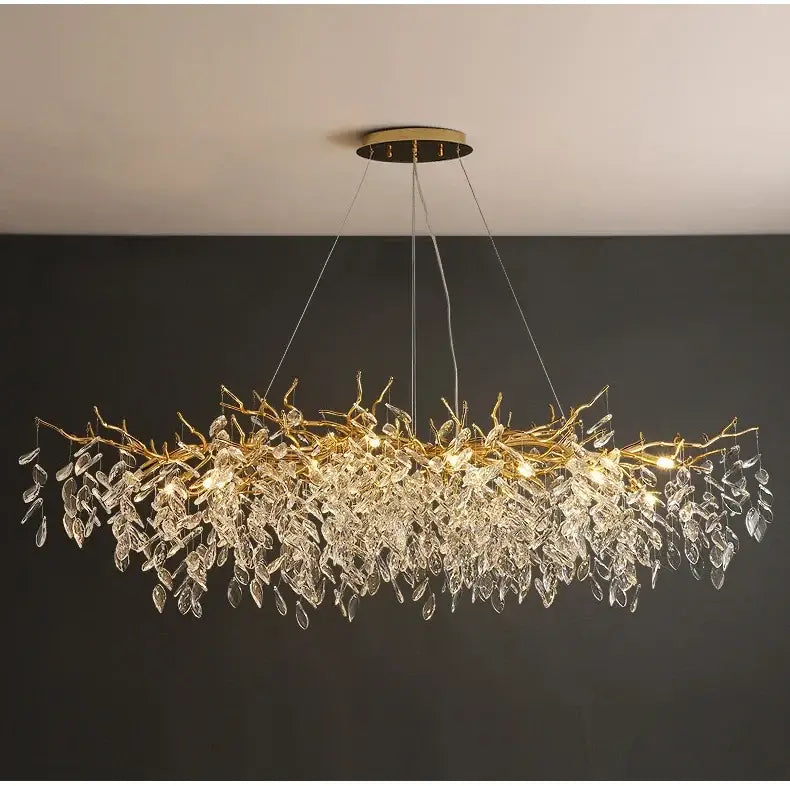 Gold crystal led chandelier with intricate crystal leaf and branch design for elegant home lighting by DecorBites