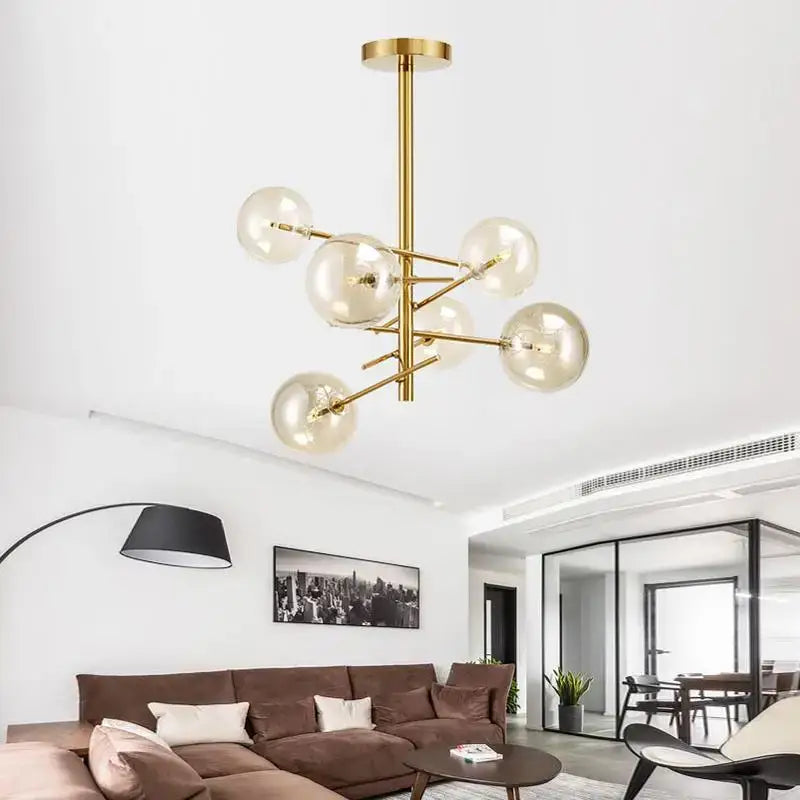 Gold glass bubble chandelier by DecorBites with multiple clear glass globe bulbs for dining room lighting