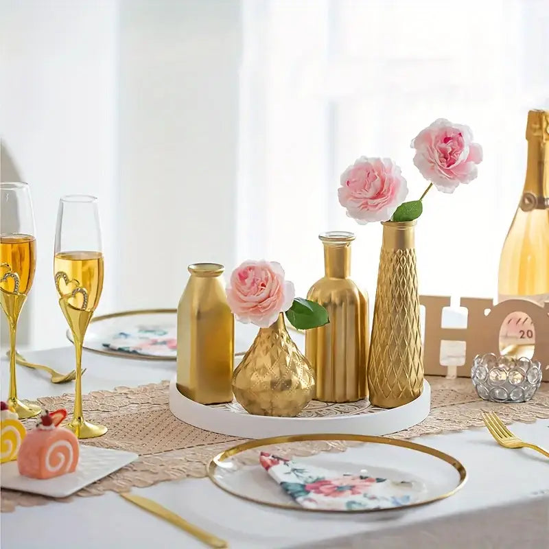 Gold glass vase with textured metallic finish and pink roses for elegant home decor by decorbites