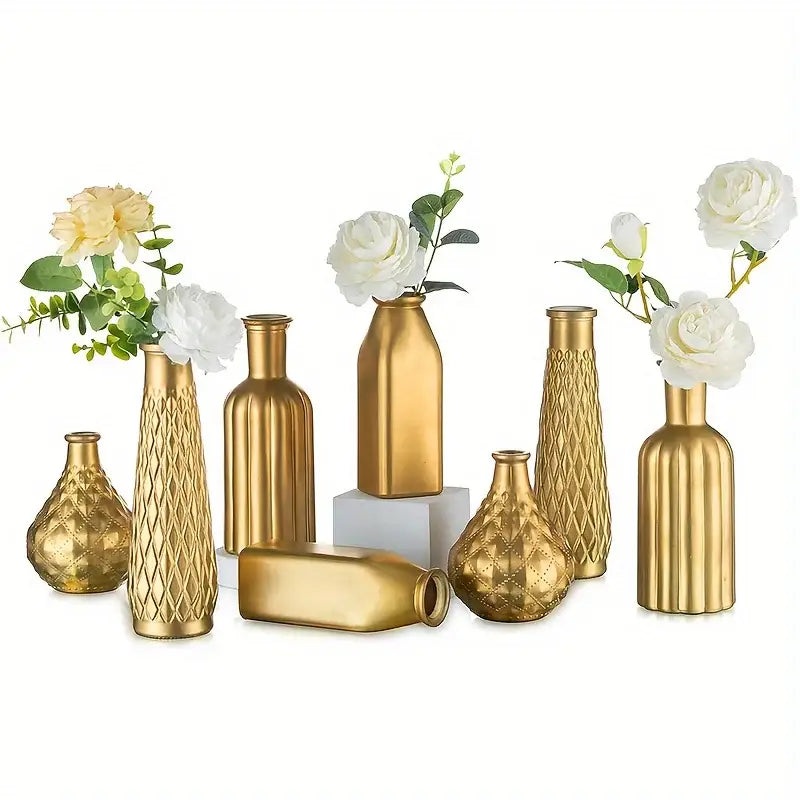 Set of eight gold glass vases with varied geometric designs and white flowers for antique art style home decor