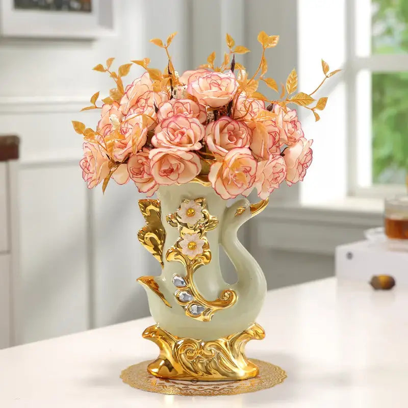 Decorbites gold glass vase is a decorative porcelain glass vase with light green glaze and gold leaf floral accents