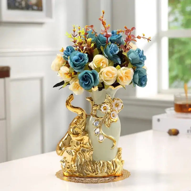 Decorbites™ gold glass vase in light green ceramic with gold elephant embellishments holding blue and cream roses