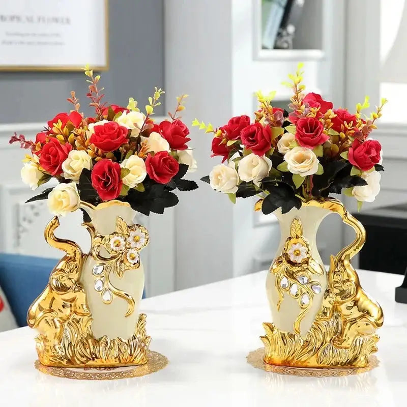Elegant cream ceramic gold glass vase with ornate handles holding red and white artificial roses for home decor