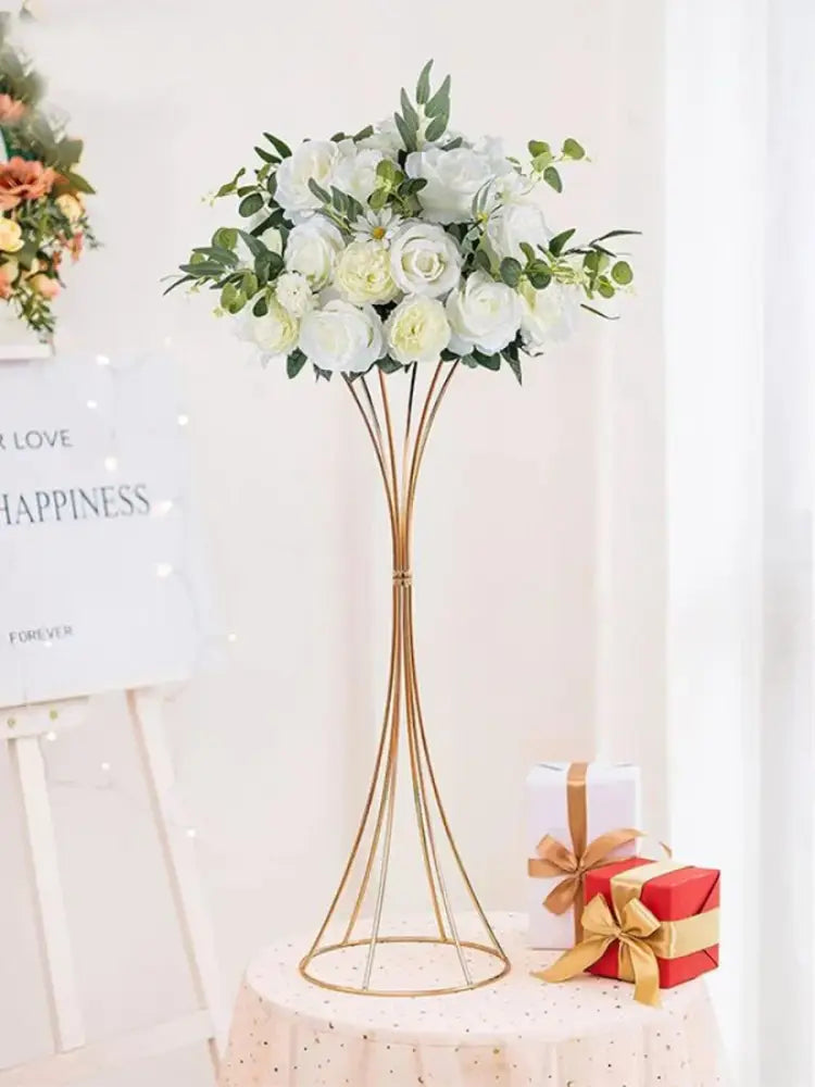 Elegant gold-toned iron flower vase set with white artificial roses and greenery for wedding decor by decorbites