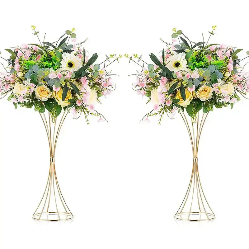 Elegant gold-toned iron flower vases with wireframe pedestal stands holding artificial soft pink yellow and white flowers