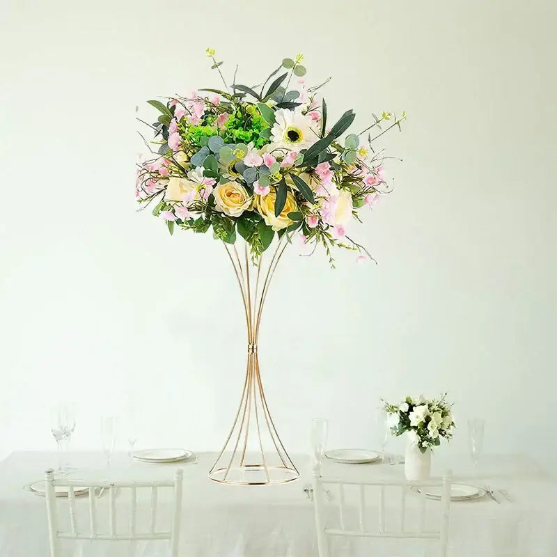 Tall gold iron flower vases with lush pink and yellow rose arrangement for wedding decor by decorbites