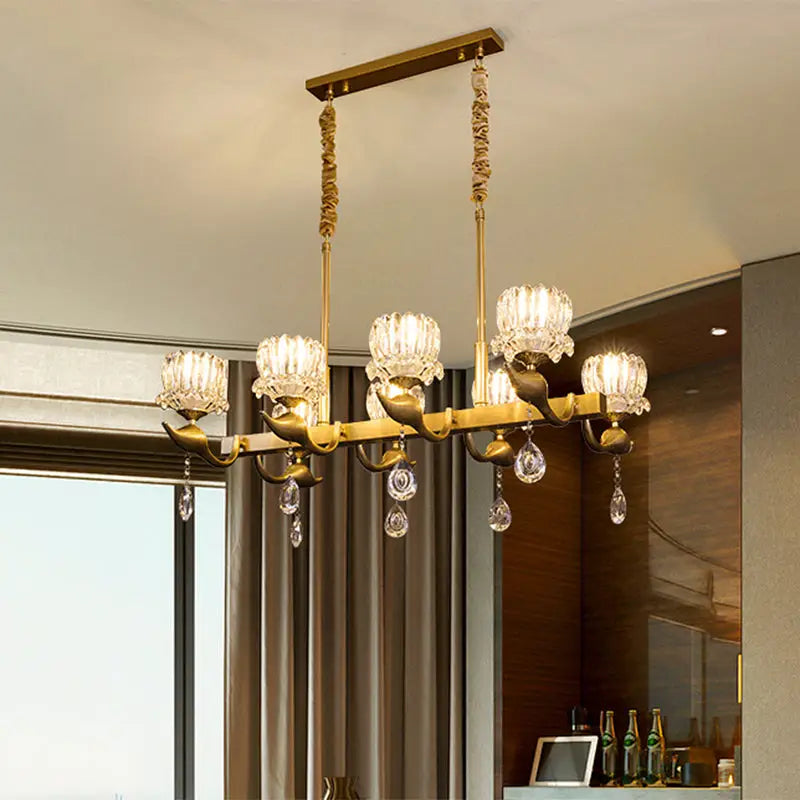 DecorBites gold island chandelier with clear crystal draping and ornate curved arms for contemporary dining room