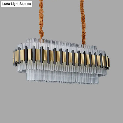 Decorbites gold led island chandelier with oval clear glass tubes and gold black metal accents suspended by brown cords