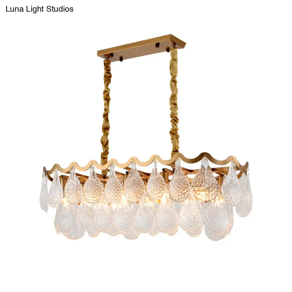 Gold-toned DecorBites island pendant with textured twisted chains and clear K9 crystal teardrops for dining room lighting