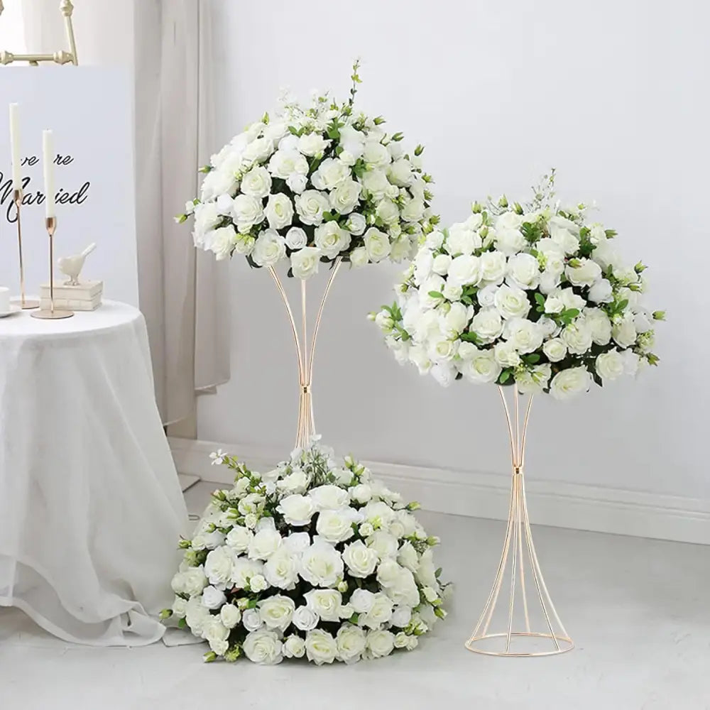 Elegant white rose floral arrangements displayed on decorbites™ gold metal trumpet flower stand vases made of metal