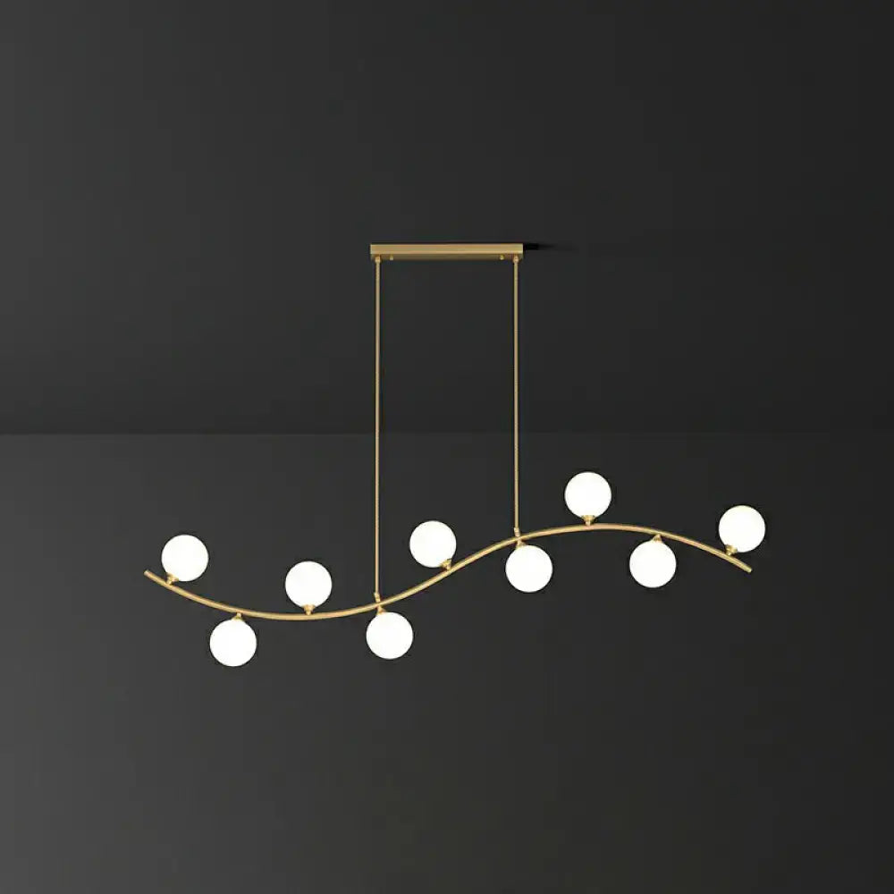 DecorBites gold milk ball glass pendant lighting with curved branch design and seven frosted globes for minimalist wavy ceiling
