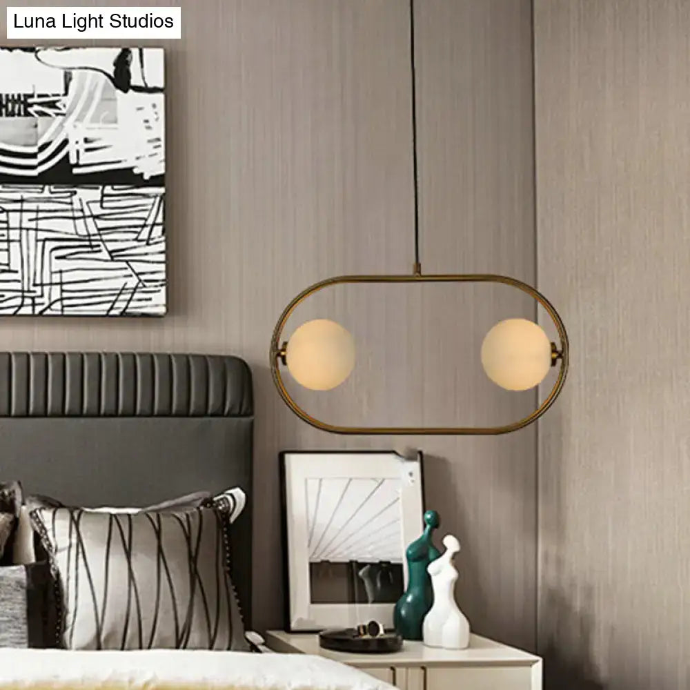 Modern brass oval pendant light with two frosted glass bulbs in decorbites gold modern globe hanging chandelier