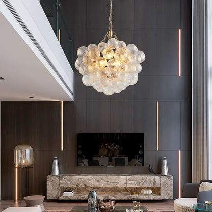 DecorBites gold pendant chandelier with adjustable height featuring bubble-like glass orbs and gold-toned chain pendant light