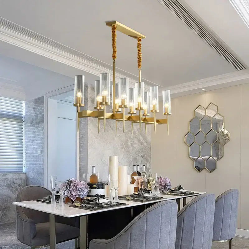 Decorbites gold plated nordic living room chandelier with gold tone, clear glass cylinders, and twisted rope chains