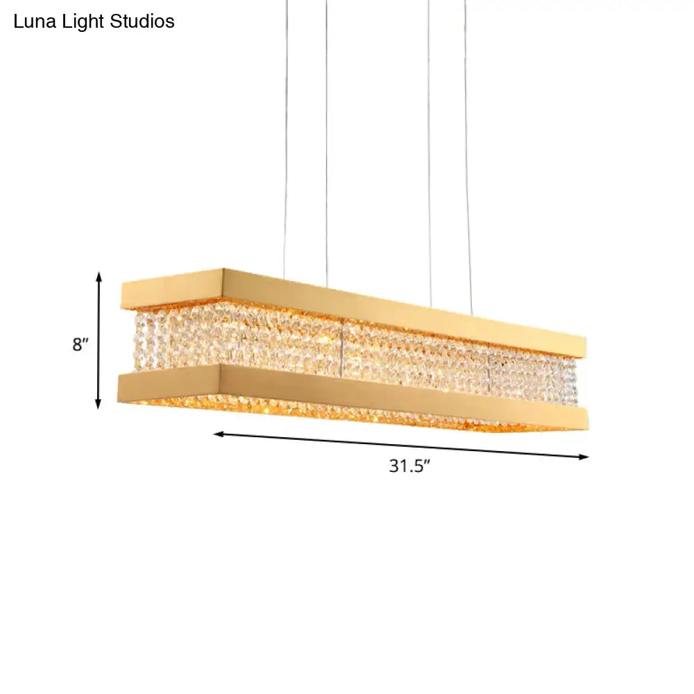 Gold rectangular pendant light with clear crystal band framed by polished gold metal for 220v-240v and 110v-120v use