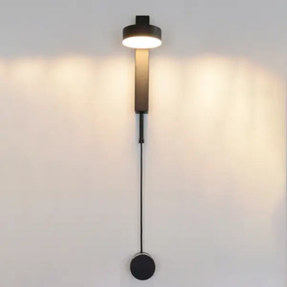 Modern black DecorBites™ wall lamp with cylindrical light head and dimmer switch for sleek, minimalist wall lamps