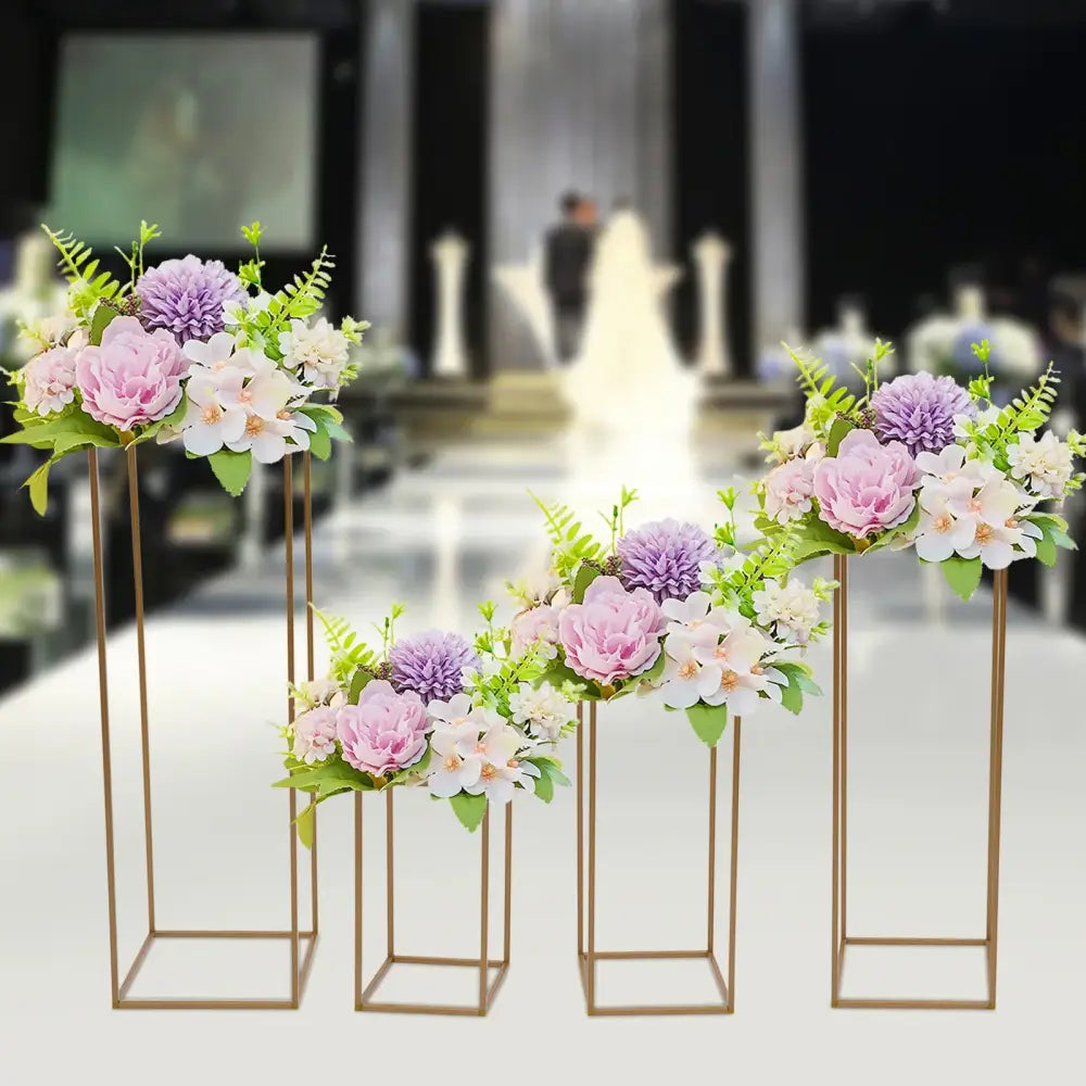 Decorbites gold wedding flower vase stand set with soft pink lavender and white blossoms on slender gold metal stands