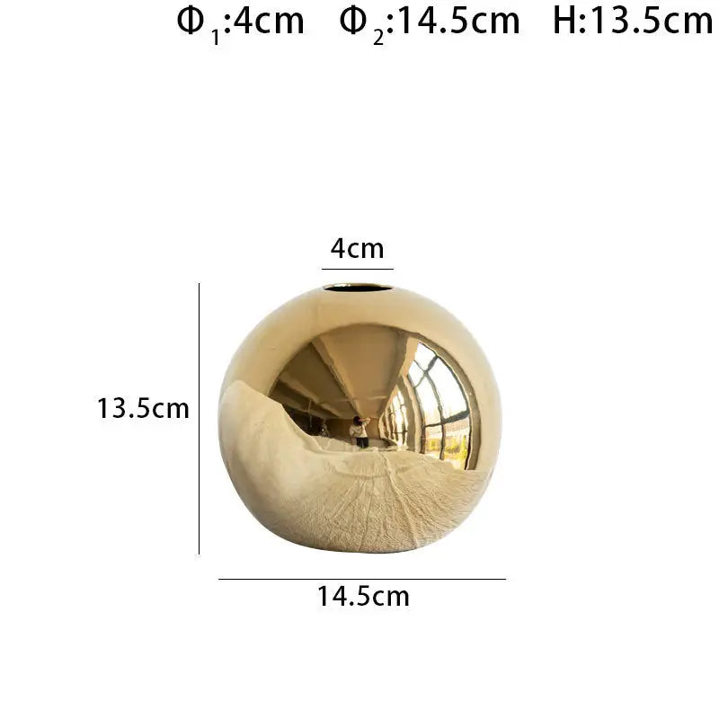 Shiny gold spherical golden ball ceramic vase with reflective surface and textured base for home decor by DecorBites