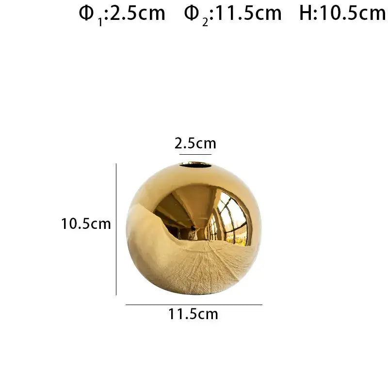A sleek gold golden ball ceramic vase with a smooth polished surface for elegant home decor by DecorBites™