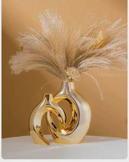 Golden glossy ceramic golden flower vase by DecorBites™ with abstract design holding pampas grass bouquet