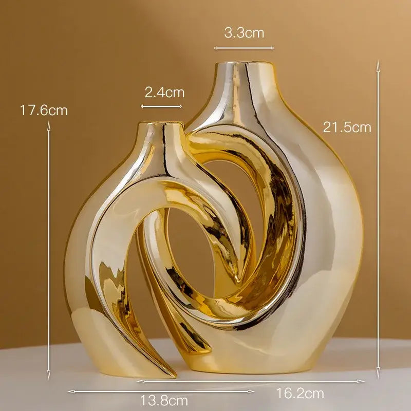 Shiny golden flower vase by decorbites featuring gold ceramic with abstract intertwined curves and a glossy finish