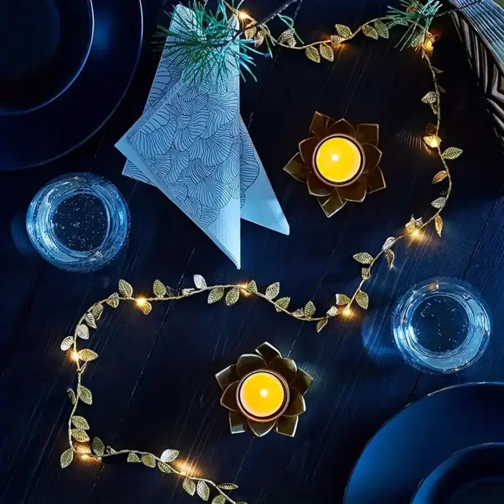 DecorBites golden silver fairy lights with tiny leaves and warm glowing bulbs arranged in a decorative arc for events