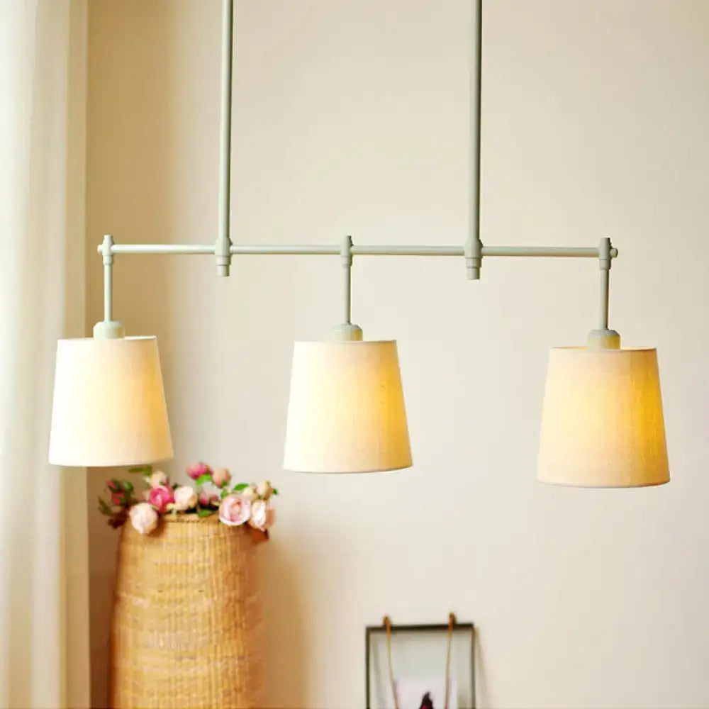 DecorBites Green Barrel fabric pendant ceiling light with three beige cylindrical shades on gray metal frame for dining room