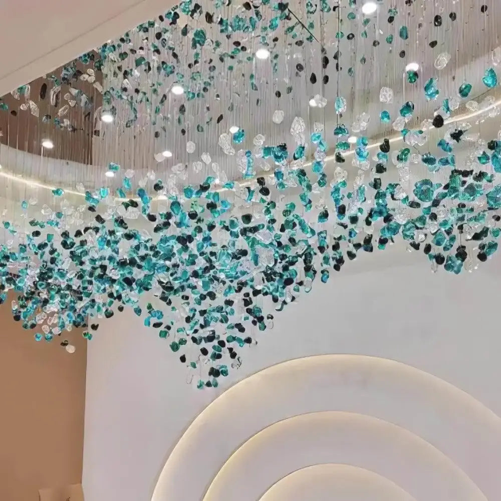 DecorBites™ green crystal stone chandelier with cascading translucent turquoise teal and clear glass fragments suspended