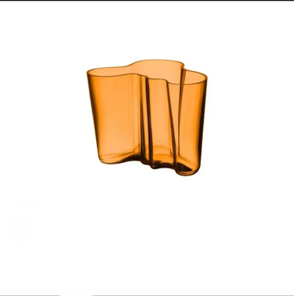DecorBites™ amber glass vase with a wavy organic form enhancing modern decor as a distinct glass vase