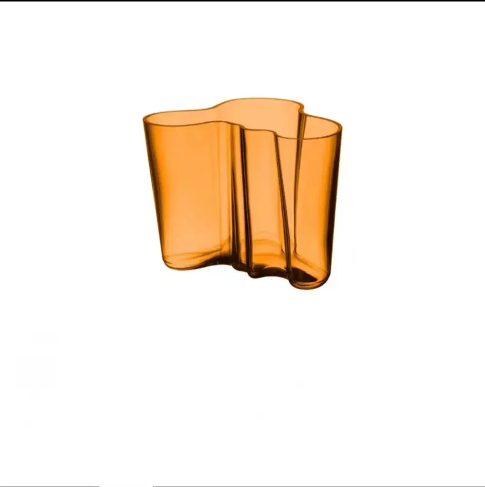 DecorBites™ amber glass vase with a wavy organic form enhancing modern decor as a distinct glass vase