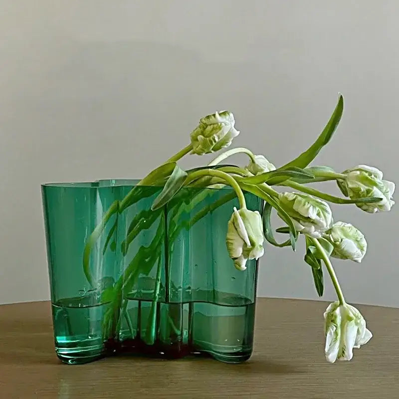 DecorBites green glass vase with a modern segmented design holding white tulips for elegant decor