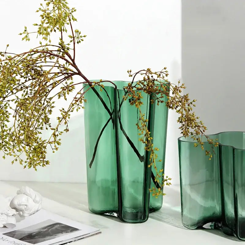 Decorbites™ green glass vase is a sleek translucent teal green glass vase with a modern segmented design for decor