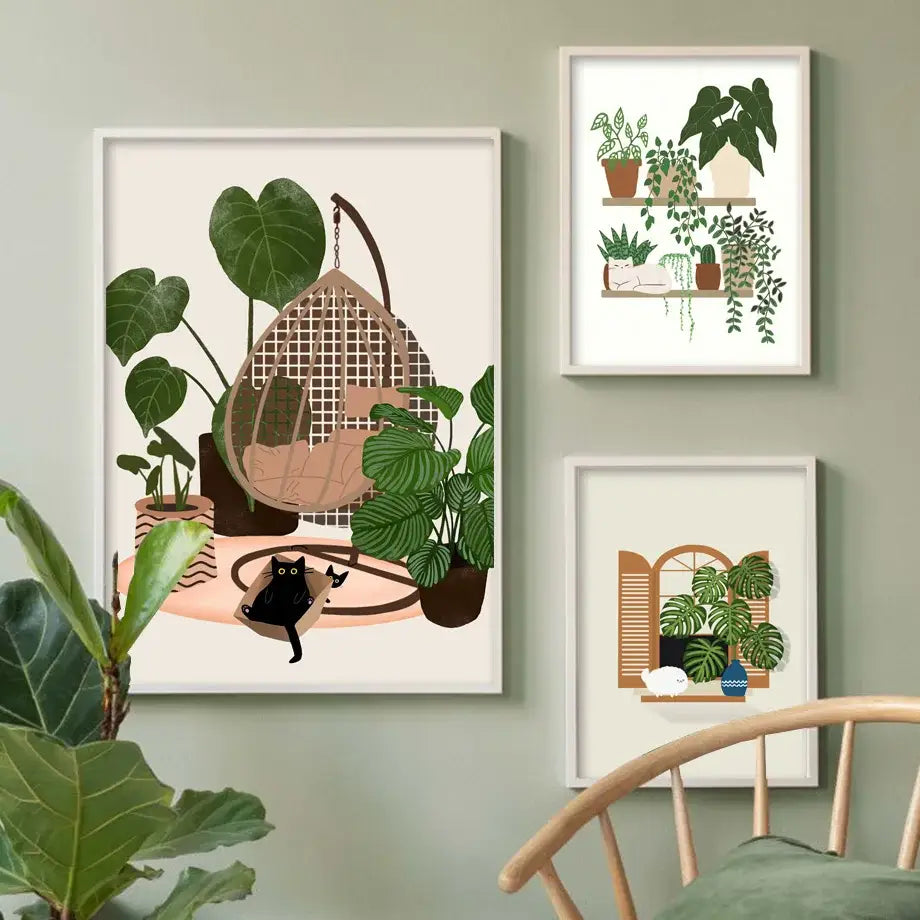 A framed canvas wall art of a woven hanging chair with green plants and a black cat by DecorBites™
