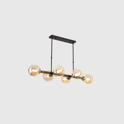 Modern black metal chandelier with five warm-toned hand-blown dimpled glass globe bulbs for restaurant use