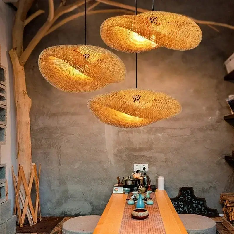 Three warm-toned woven bamboo pendant ceiling lights by decorbites in a modern rustic setting