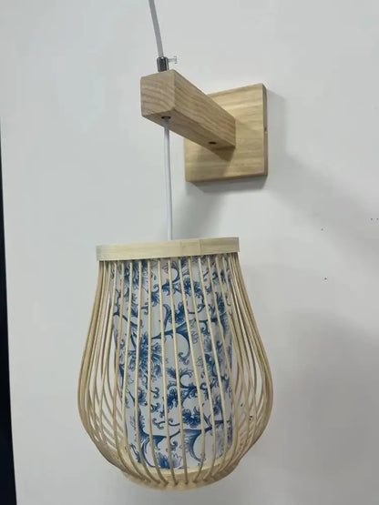 Decorbites hand-knit bamboo pendant ceiling light with light-colored bamboo frame and blue white ceramic shade