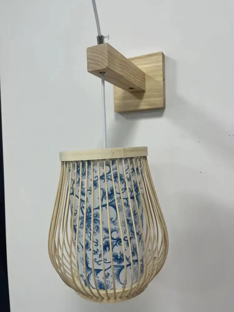 Decorbites hand-knit bamboo pendant ceiling light with light-colored bamboo frame and blue white ceramic shade