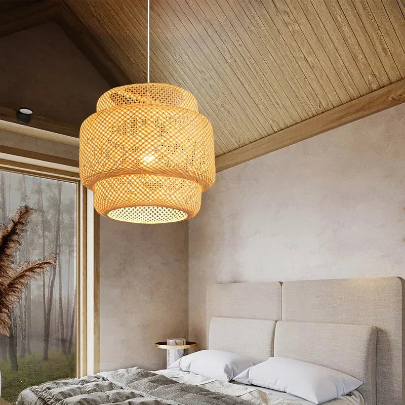 A warm tiered pendant lamp in chinese style hand knitted from natural woven rattan with a delicate lattice pattern