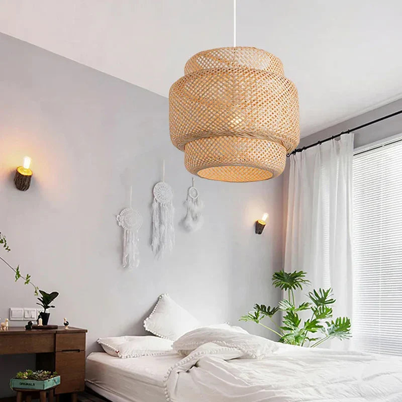 A tiered woven rattan pendant light in natural beige featuring an intricate lattice pattern and hand knitted chinese style